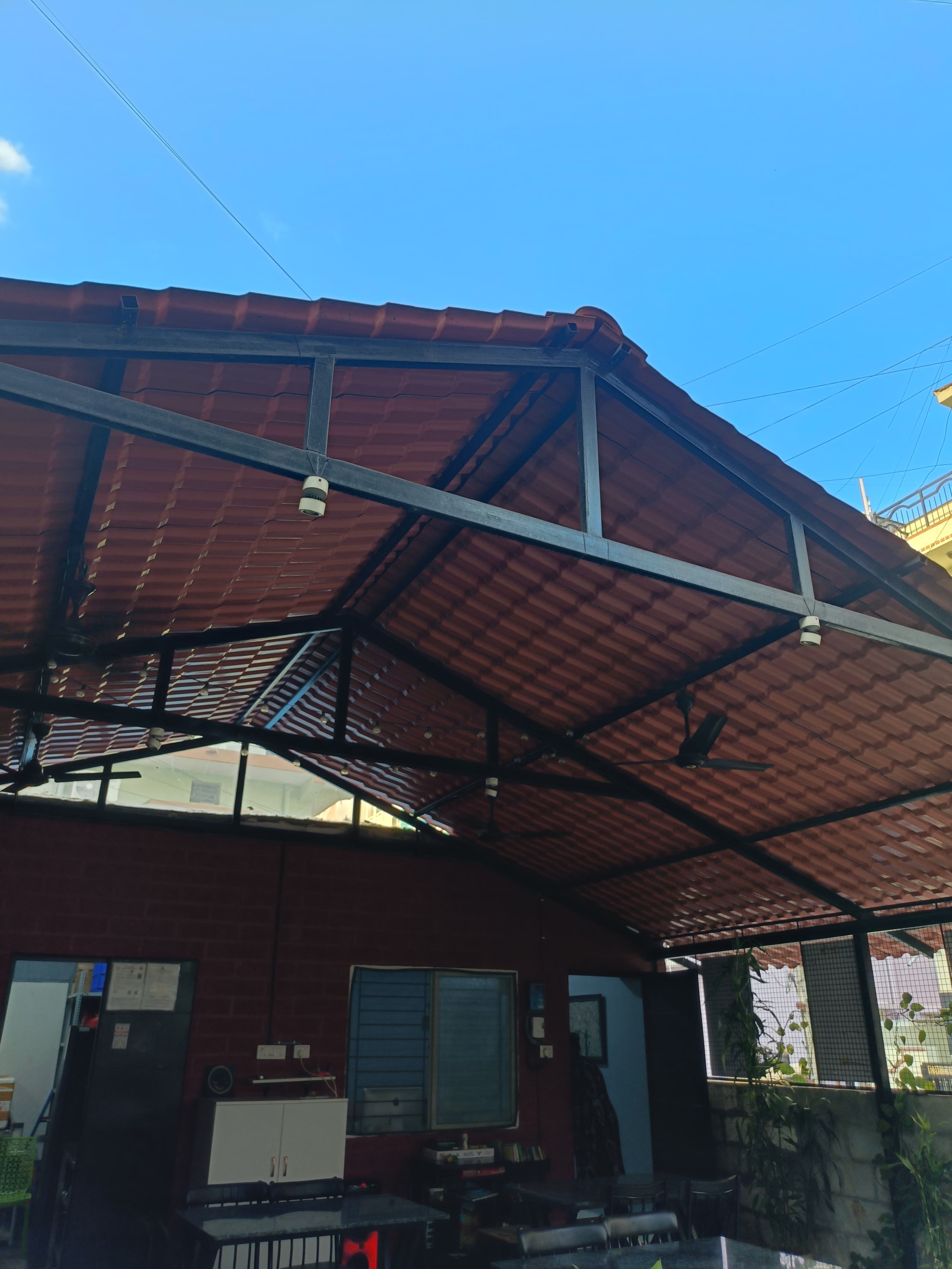 Rapchai terracotta canopy against blue sky