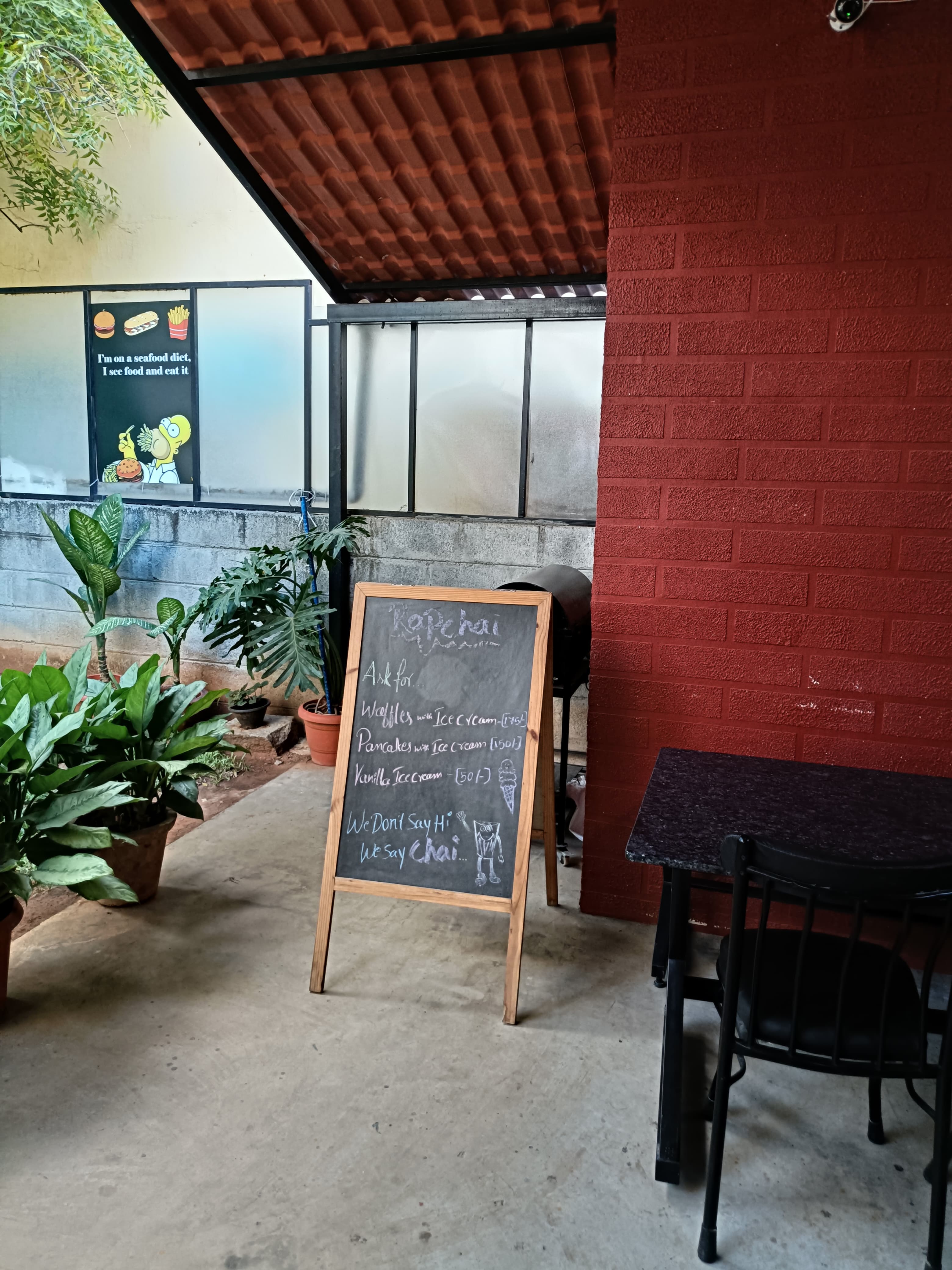 Rapchai interior corner with handwritten chalkboard menu