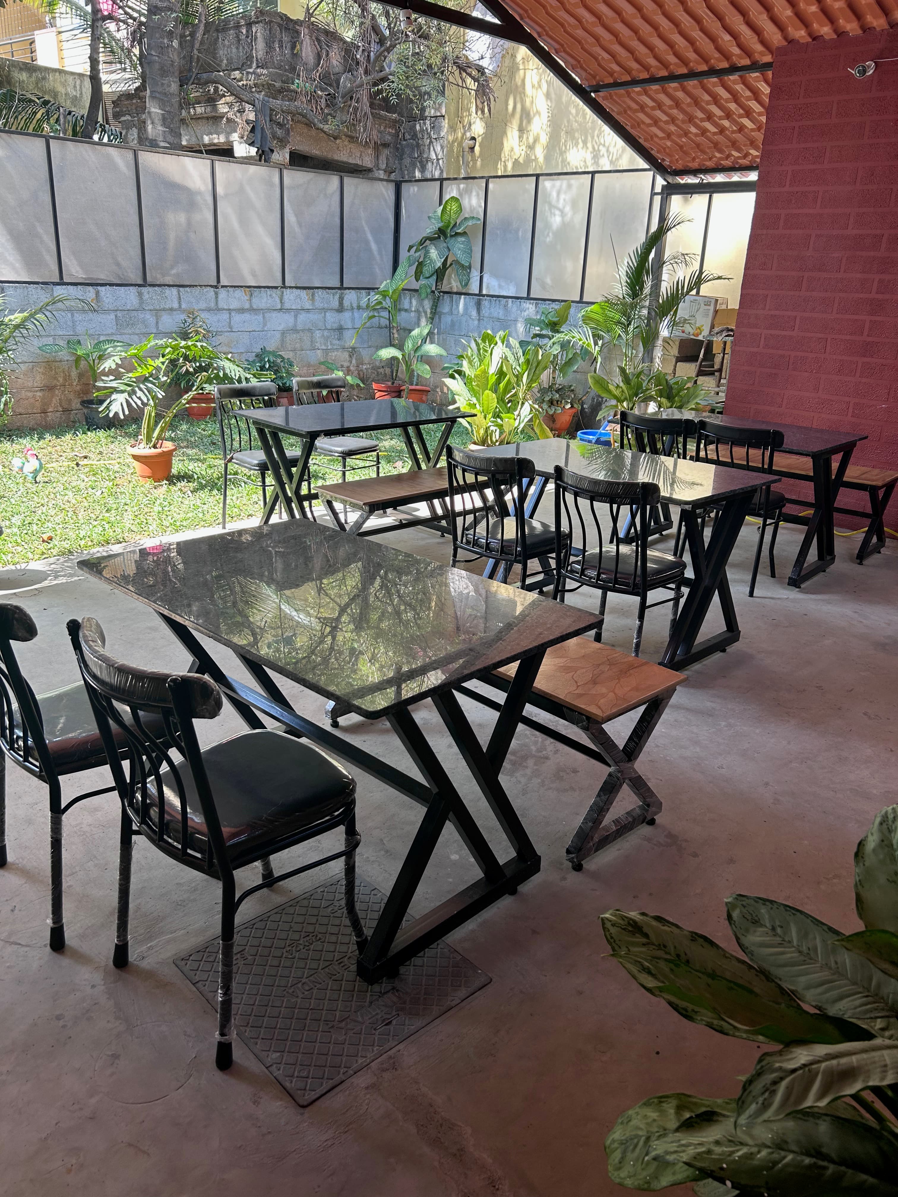 Rapchai café seating area with garden view in Bangalore